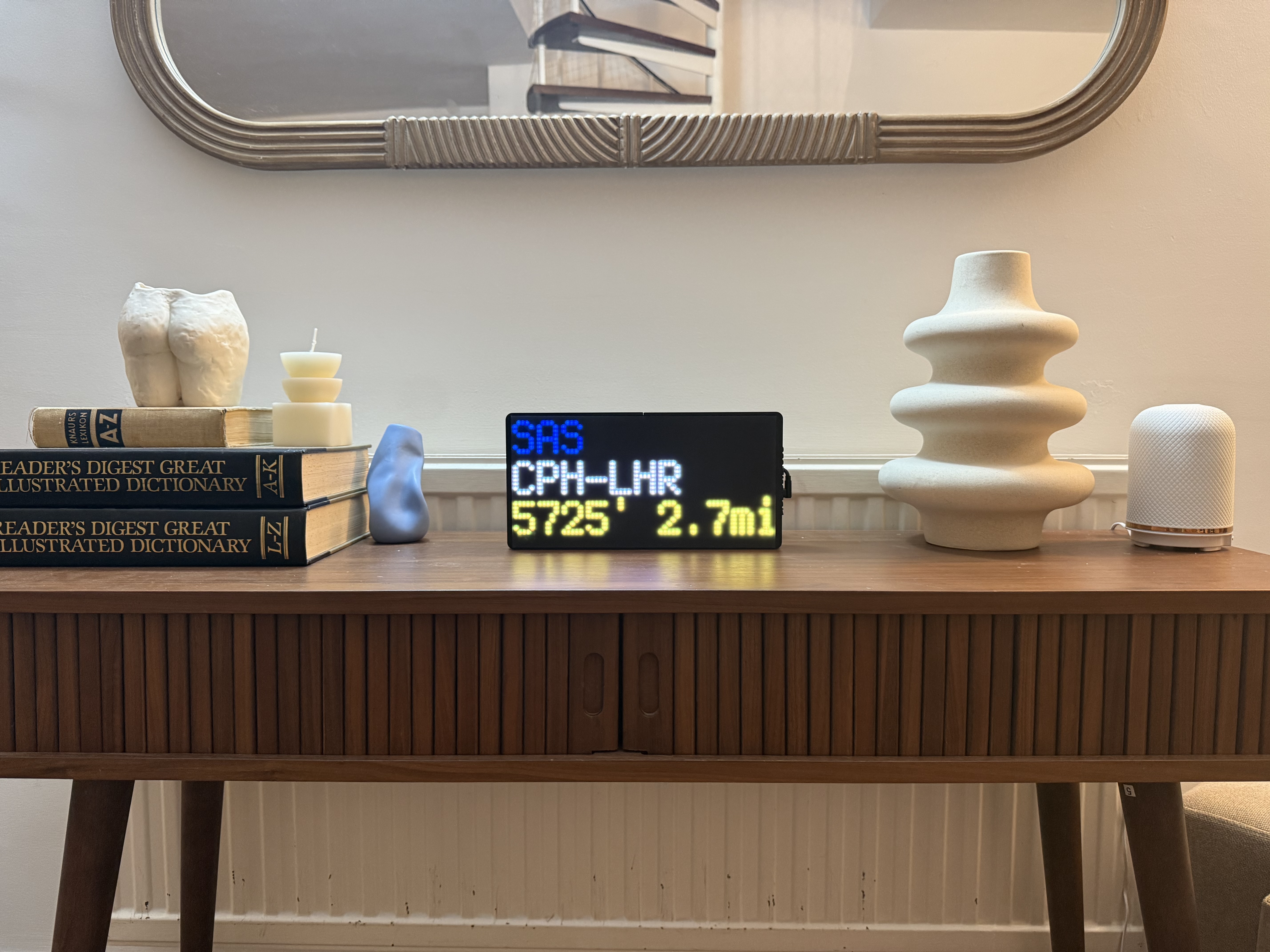 NearestPlane flight tracker display on a shelf at home